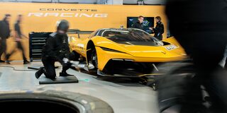 Side View of a Yellow and Black 2026 Corvette CX.R Racing on a Track