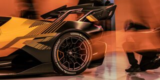 Side View of a Yellow and Black 2026 Corvette CX.R Racing on a Track