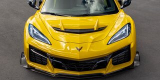 Front View of a Yellow Chevy Corvette ZR1 Stationed on a Road