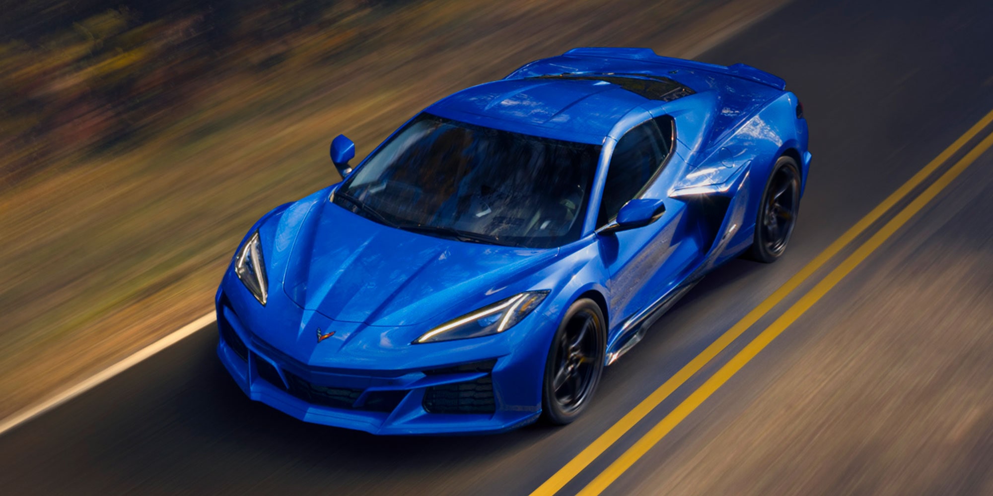 Overhead View of a Blue Chevy Corvette E-Ray Driving Down the Road