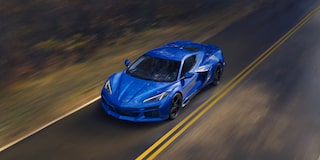 Overhead View of a Blue Chevy Corvette E-Ray Driving Down the Road