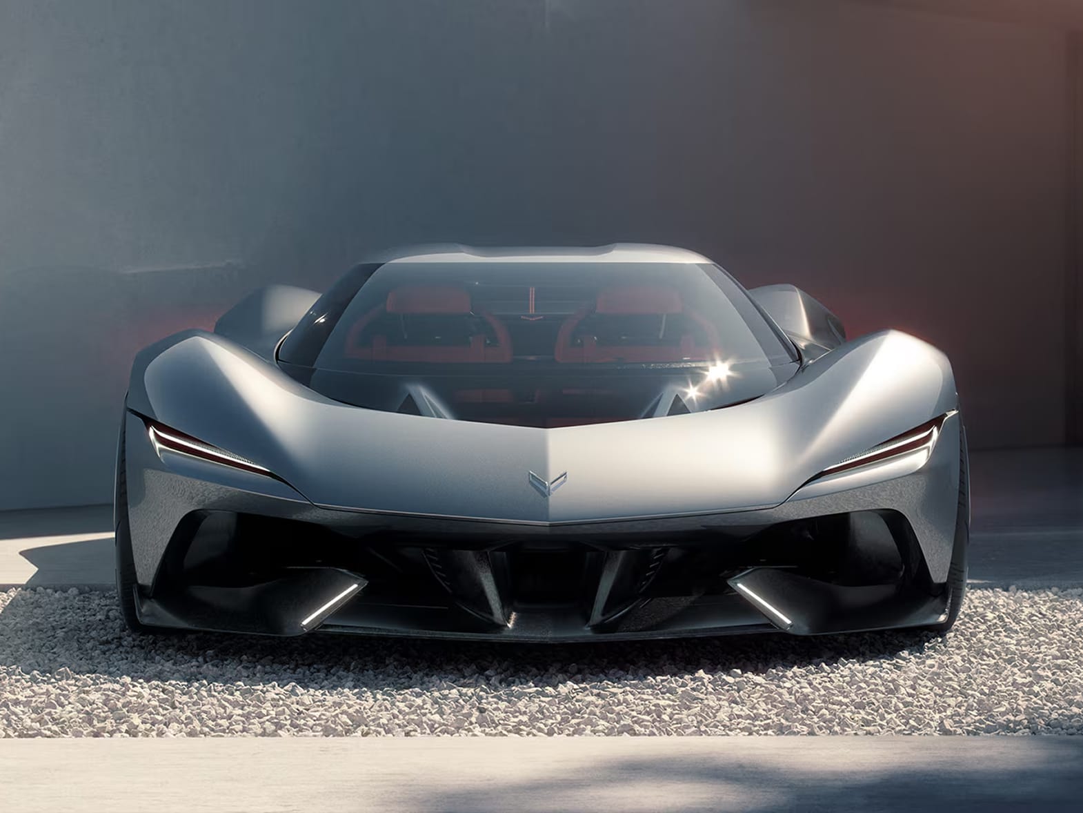 Front view of Corvette CX in a black metallic finish, parked on silver-grey tarmac.