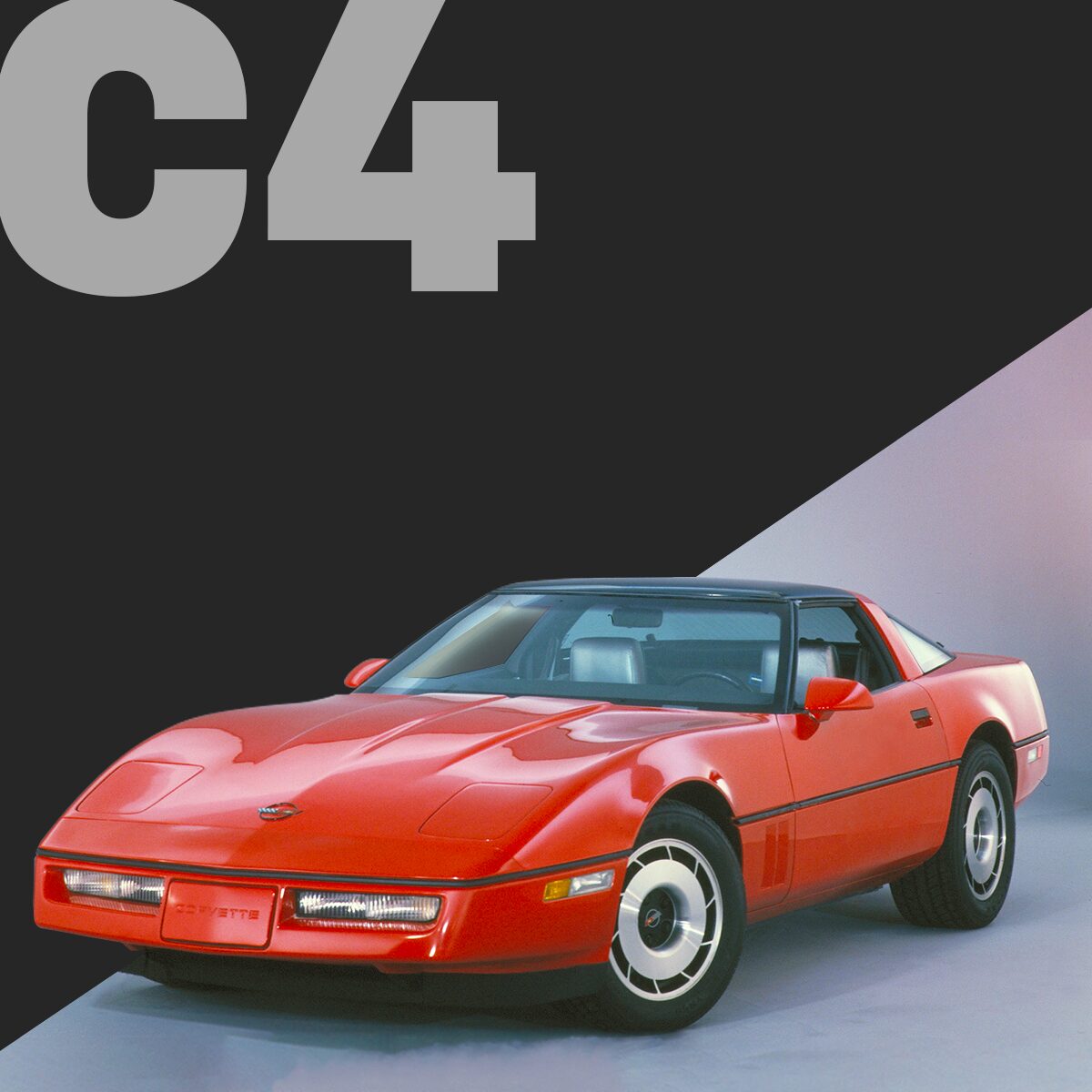 Three-quarter view of a brilliant-red Corvette C4 coupé, parked on cement.
