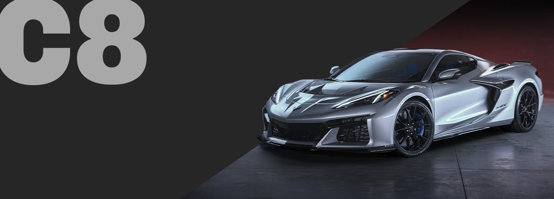 Three-quarter view of a Corvette ZR1X C8 in Blade Silver Metallic, parked in a showroom.