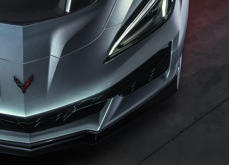 Aerial close-up view of the front section of a Chevy Corvette ZR1X hypercar, finished in Blade Silver Metallic.