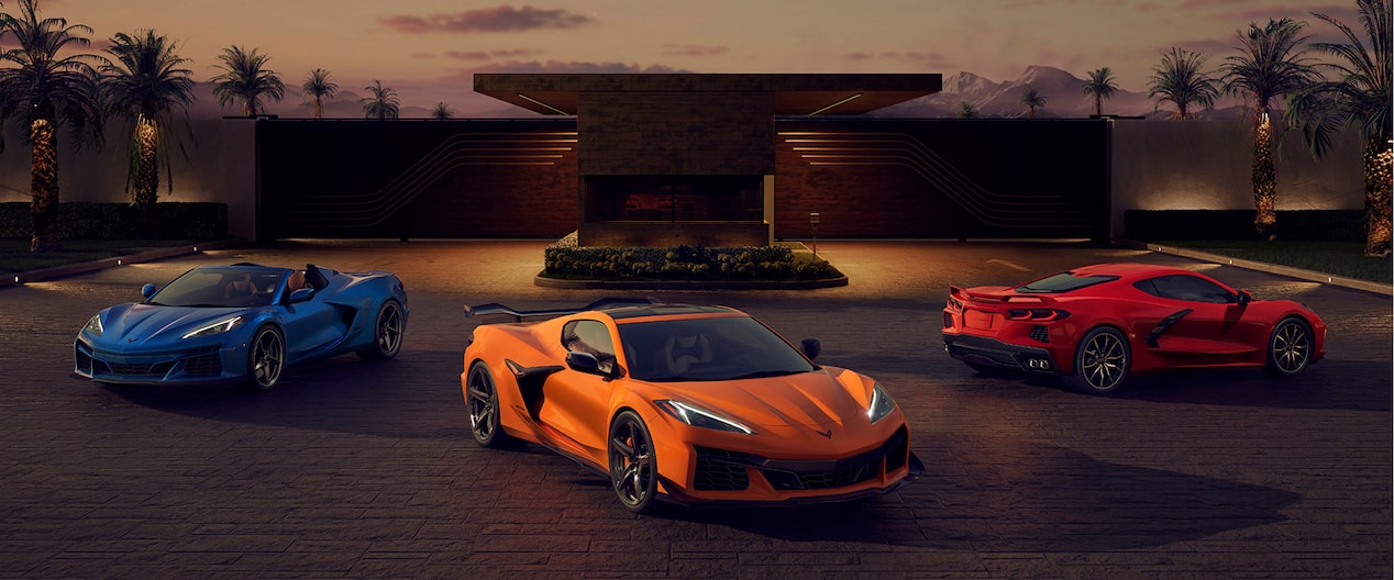 Corvette Stingrays Parked in Front of a House