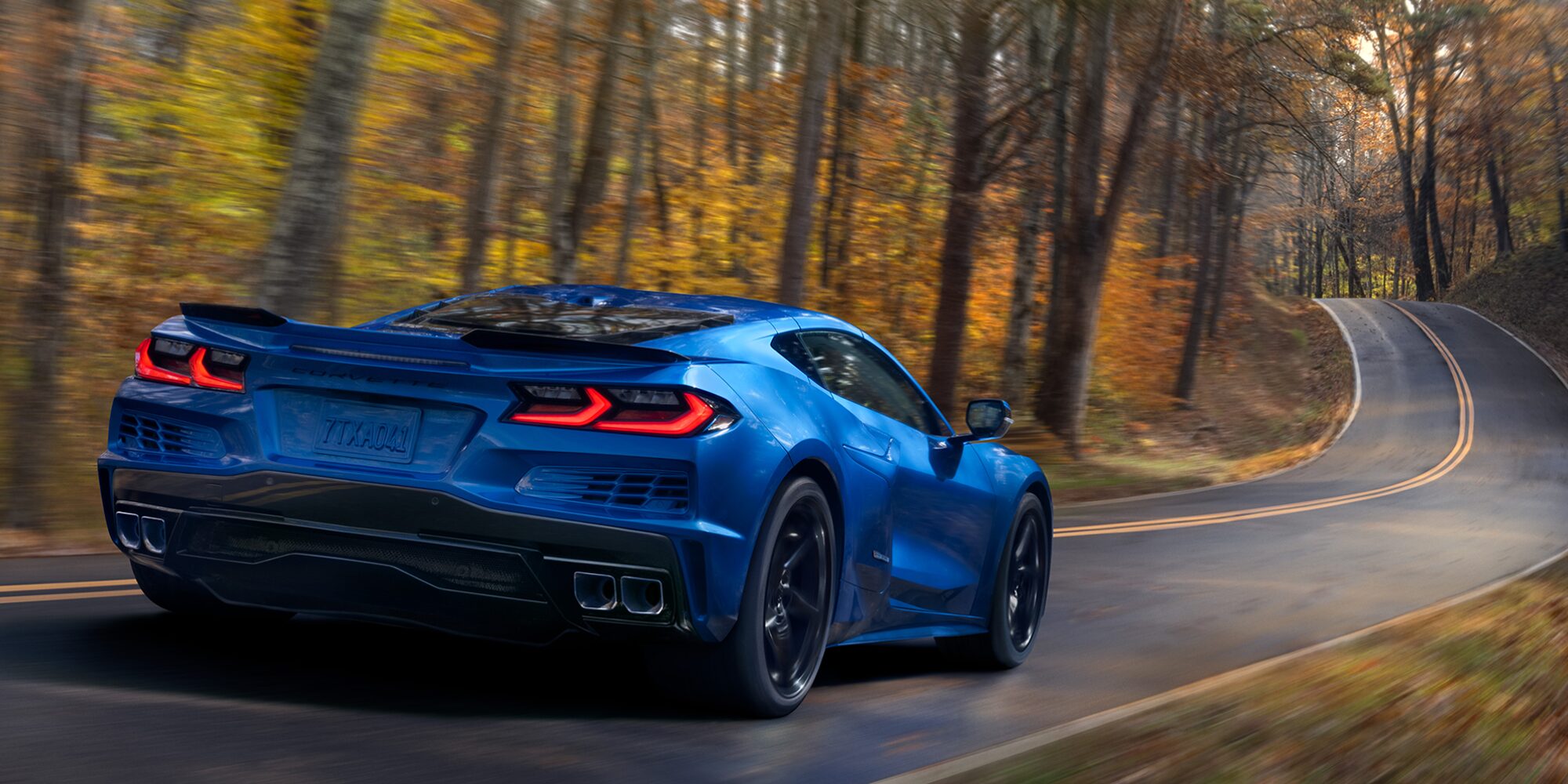 Overhead View of a 2025 Gray Chevy Corvette E-Ray Driving Down the Road