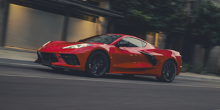 2026 Chevy Corvette Stingray Speeding Down a Road
