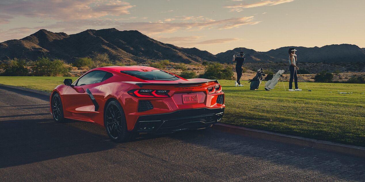 A Couple in Tennis Clothes Walking Toward Their 2026 Chevy Corvette Stingray